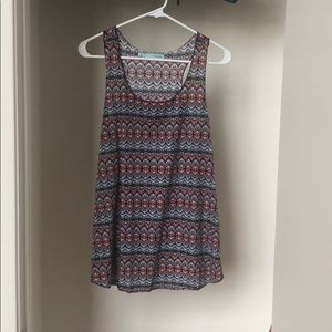 Navy blue tank with orange and white pattern